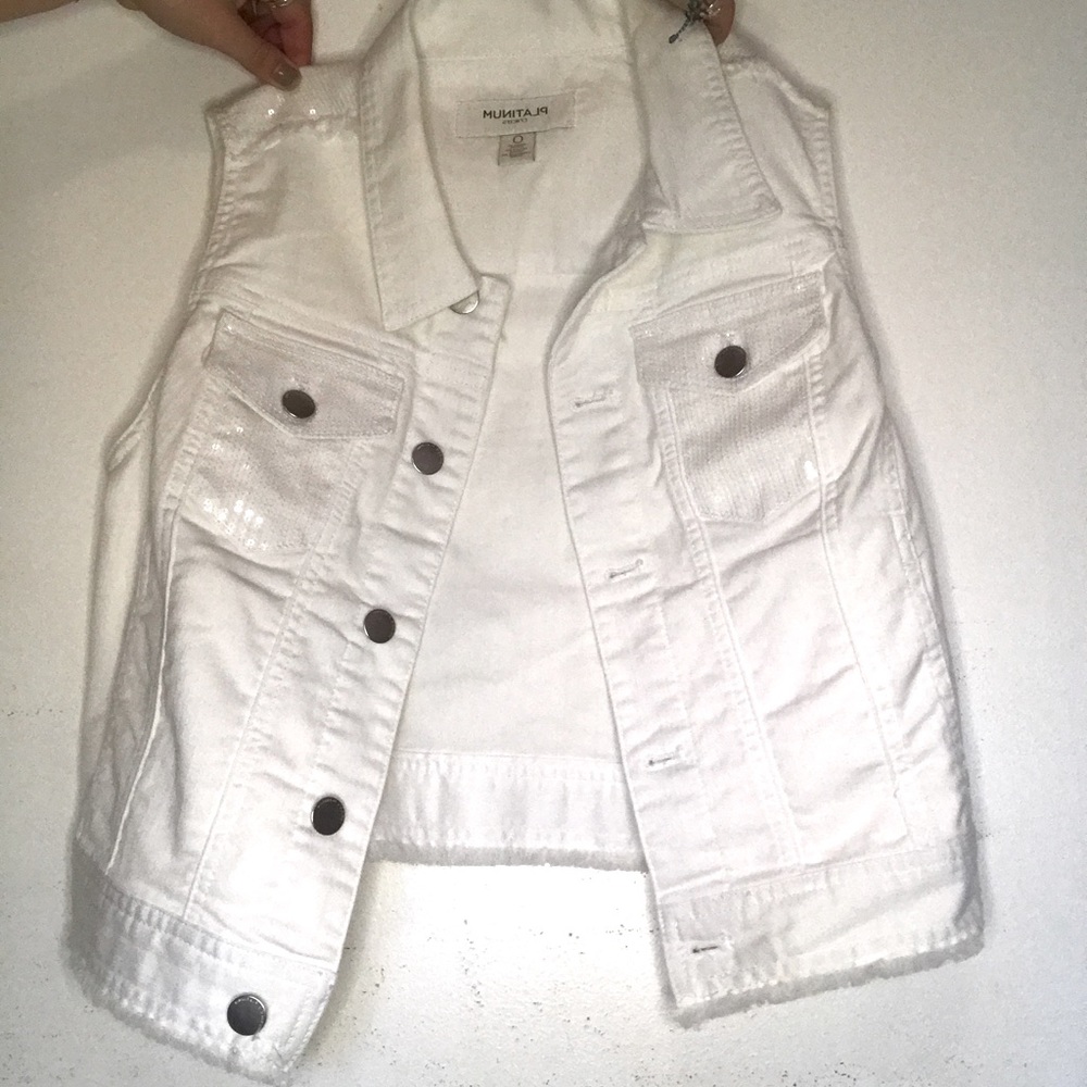 Platinum Chicos white sleeveless jacket.